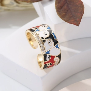 Macro shot of 18K gold plated adjustable ring with enamel face and zircon details