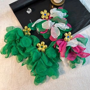 Handmade oversized floral tassel earrings with vibrant layered petals and metallic stamens