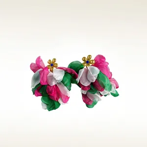 Handmade floral tassel earrings with vibrant pink petals and golden center accents