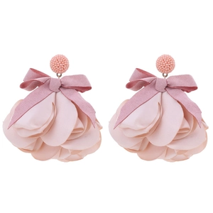 Close-up of pink fabric flower earrings with satin bows and layered chiffon petals