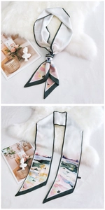 Détail de l'écharpe en soie crème avec bordures vertes et imprimé artistique abstrait