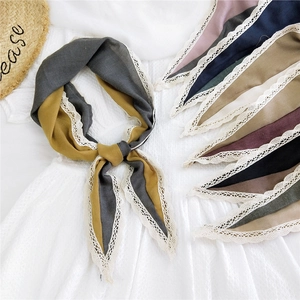 Diamond patterned cotton linen neck scarf with lace trim shown in various colors