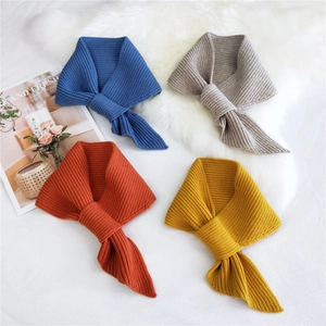 Solid color ribbed knit neck warmer scarves in four vibrant colors on a soft plush background