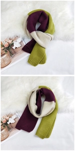 Detail of tricolor patchwork knitted scarf with ribbed texture in purple beige and green