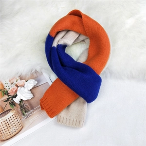 Three-color patchwork long knitted scarf in orange, royal blue and beige for winter