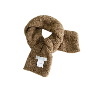 Brown bouclé fleece loop scarf for women featuring a soft texture and brand label