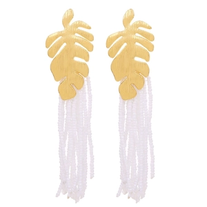 Detail of gold monstera leaf alloy earrings with handmade long white seed bead tassels