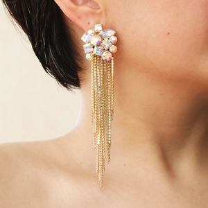 Luxurious gold-plated long tassel earrings with sparkling iridescent rhinestones on model