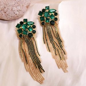 Detail of emerald green crystal long tassel earrings with sparkling gold chain fringe