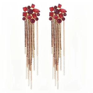 Red rhinestone cluster earrings with long gold metal tassels on white background