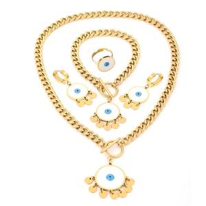 Golden stainless steel jewelry set featuring blue enamel evil eye and dangling gold discs