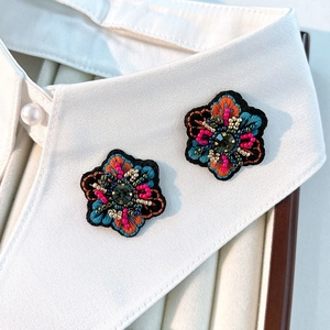 Retro embroidered floral earrings with colorful beads and dark green rhinestone accents