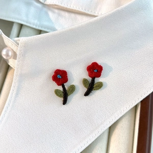 Exquisite red floral embroidery studs with green leaves on white shirt collar