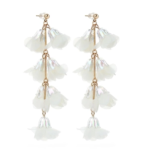 Detail of white fabric flower tassel earrings with golden accents and cascading petal layers