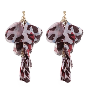 Detail shot of leopard print fabric tassel earrings with gold metal studs and chiffon petals