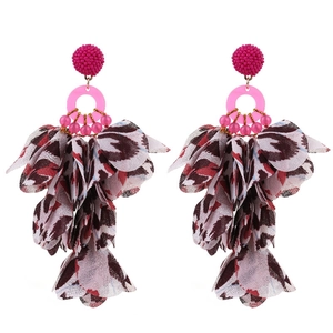 Detail of bohemian long tassel earrings with pink beads and leopard print chiffon petals