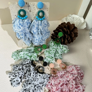 Handmade fabric flower earrings with long floral tassels and colorful beads