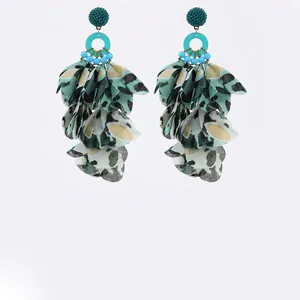 Bohemian floral drop earrings with green leopard print fabric petals and beaded details