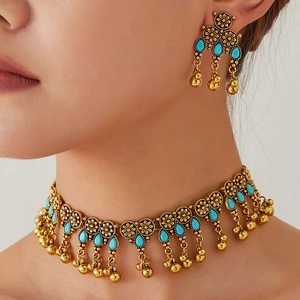 Vintage gold-tone jewelry set with turquoise beads and bell charms for women