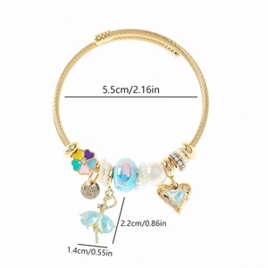 Detail of adjustable cable bracelet with enamel flower and blue ballerina pendant