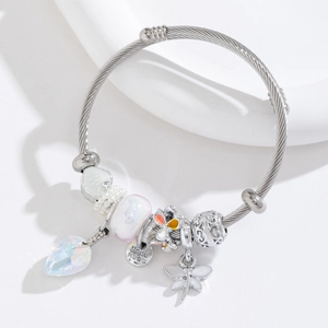 Close-up of stainless steel wire bracelet with dragonfly, heart crystal and handmade charms