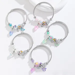 Detailed close-up of handmade stainless steel charm bracelets with colorful glass beads