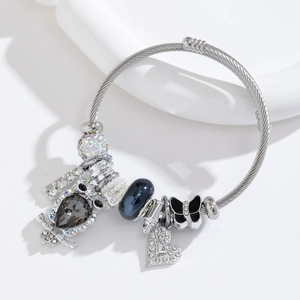 Adjustable stainless steel bangle with owl, heart pendants and blue glass beads