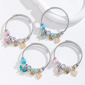 Detailed macro of stainless steel wire bracelets featuring butterfly and heart charms