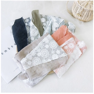 Detailed lace trim on cotton linen scarves in various colors with floral pattern