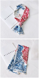 Detail of long narrow silk scarf with red and blue architectural city map print design