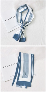 Detail view of blue and white striped skinny scarf with premium silk-like texture