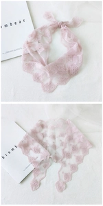 Detailed view of light pink floral lace scarf with delicate crochet wavy edges