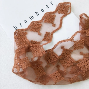 Brown embroidered lace triangle scarf with daisy cutouts and sheer floral texture