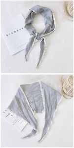 Detail of black and white gingham cotton linen scarf with elegant lace crochet edge