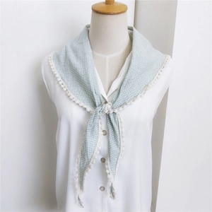 Plaid cotton linen triangular scarf with white lace trim on a mannequin display