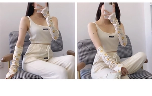 Detail of light beige ribbed lounge set with lemon print cooling sun sleeves