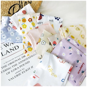 Detail view of fruit print cooling sleeves with strawberry and avocado patterns