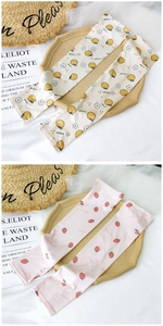 Detail of cartoon orange and strawberry print ice silk arm sleeves for sun protection