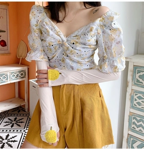 Close-up of ice silk cooling sleeves featuring a cute durian print for sun protection