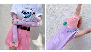 Detail of light purple sun protection sleeves with peach print and fingerless design