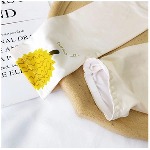 Detail of ice silk sun protection sleeve with cute cartoon durian print on milky white fabric