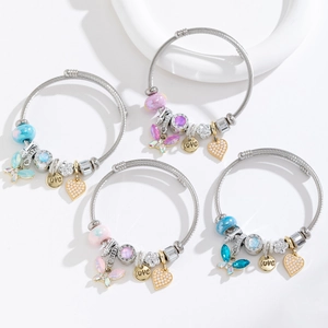 Detail of beaded stainless steel bracelets with crystal butterfly and heart charms
