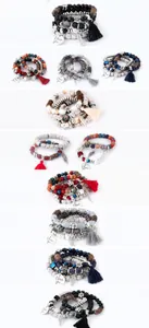Detail view of multi-layer Bohemian beaded bracelet with tassels and feather pendants