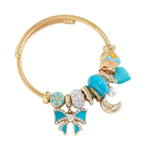 Bracelet jonc doré ajustable avec breloques papillon et perles en cristal bleu sarcelle