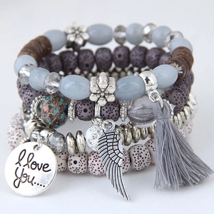 Bohemian multilayer beaded bracelet with cat eye stone wings and tassel pendants