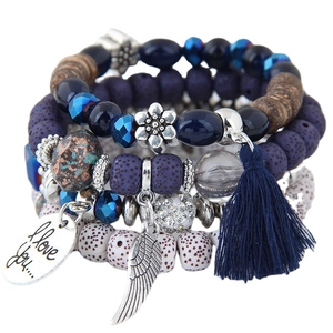 Bohemian multilayer beaded bracelet with cat eye stone, wing charm and blue tassel