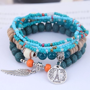 Bohemian multilayer beaded bracelet with silver wing charm and Paris Eiffel Tower disc