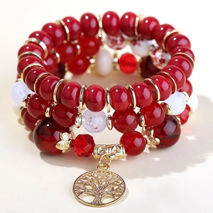 Bohemian multilayer beaded bracelet with red beads and golden Tree of Life charm pendant