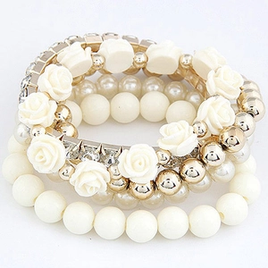Elegant multi-layer beaded bracelet with cream roses, pearls, and rhinestone spacers