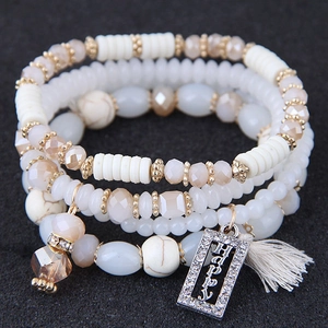 Bracelet bohème multicouche avec perles de cristal champagne et breloque Happy à franges